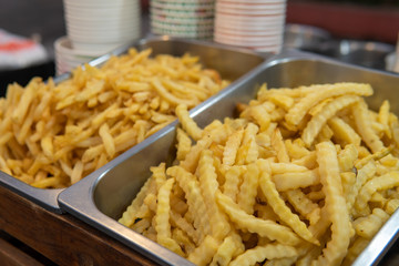 French fries for sale in large metal bin
