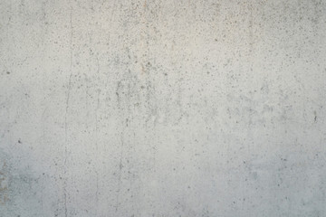 Texture of a smooth gray concrete wall as background or wallpaper. Close up of concrete wall with rough texture. Cement texture.