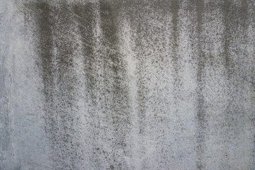 Texture of a smooth gray concrete wall as background or wallpaper. Close up of concrete wall with rough texture. Cement texture.