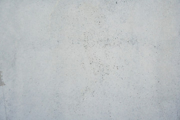 Texture of a smooth gray concrete wall as background or wallpaper. Close up of concrete wall with rough texture. Cement texture.