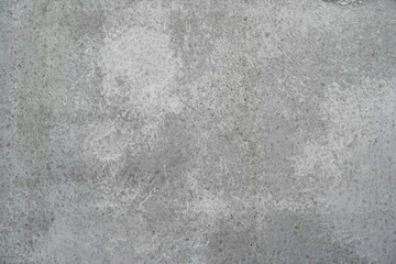 Texture of a smooth gray concrete wall as background or wallpaper. Close up of concrete wall with rough texture. Cement texture.