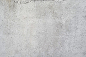 Texture of a smooth gray concrete wall as background or wallpaper. Close up of concrete wall with rough texture. Cement texture.