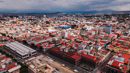 Aerial photography of the center of Toluca, Mexico, you can see several emblematic places such as the Cosmo Vitral, the Plaza de los Martires