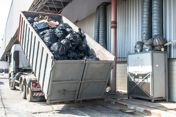 Truck collects a bucket with garbage to be recycled in the north side of Sao Paulo city.