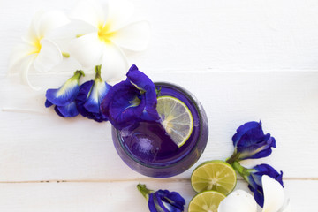 herbal healthy drinks  mix lemon and  flower butterfly pea purple cold cocktail water local flora...