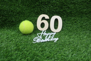 Tennis 60th Birthday Anniversary with tennis ball and number 60th on green grass