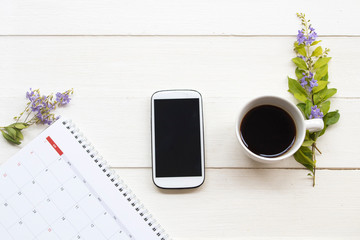 calendar planner ,mobile phone and hot coffee of lifestyle at office arrangement flat lay style on...