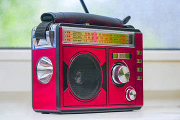 Old radio receiver with analog tuning scale