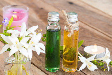herbal essential oils aromatherapy extract flowers cock tree local flora of asia and candlelight of lifestyle relaxation decoration on background wooden