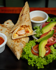 Beef Burrito with avocado and salad