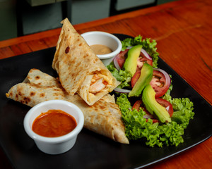 Beef Burrito with avocado and salad