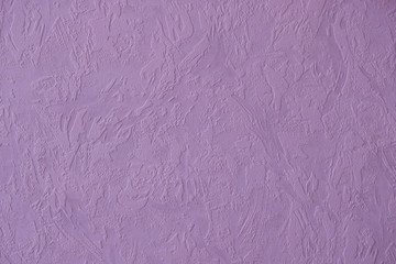 Textured purple wallpaper. Copy space.