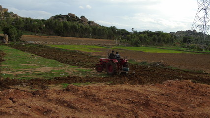 Fototapeta premium man riding a tractor