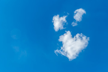 Fototapeta na wymiar Romantic cloud in the shape of a heart on a blue sky. Love concept. Copy space.