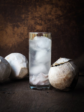 Iced young coconut juice in tall glass