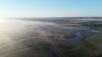 A plume of fog envelops the river.