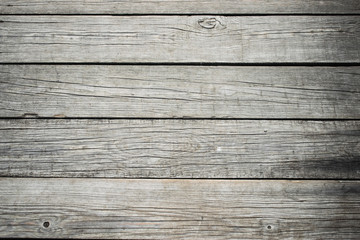 Fototapeta premium the background consists of narrow wooden strips of gray color arranged horizontally