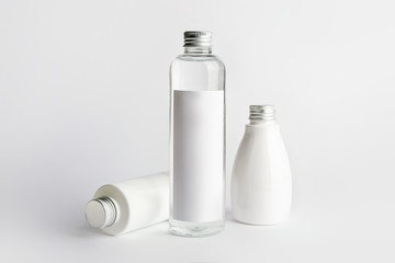 Different cosmetic products on light background