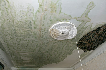 Damaged ceiling after a water pipe burst