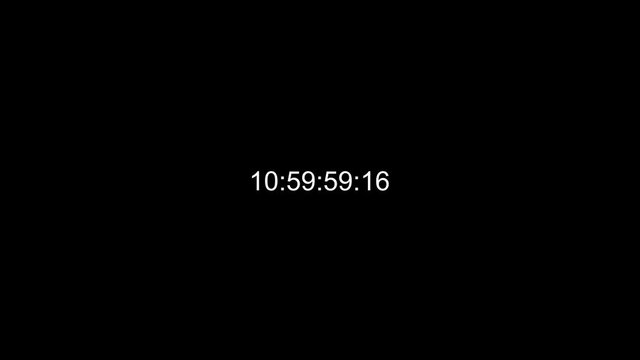 very fast timecode numbers on a black background. 4k video