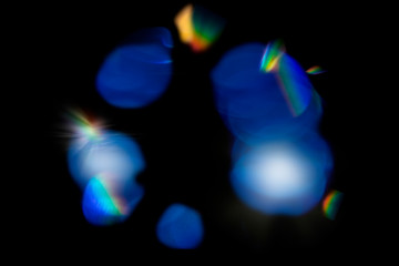 Lens flare, Bokeh lights. Reflections from glass, diamond, crystal. Defocused shining colorful...