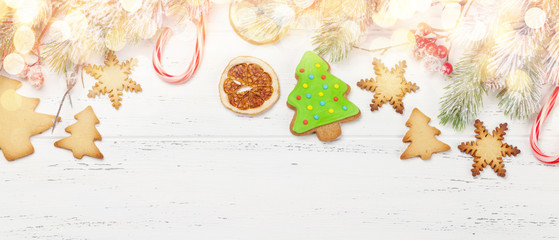 Christmas greeting card with fir tree and gingerbread cookies