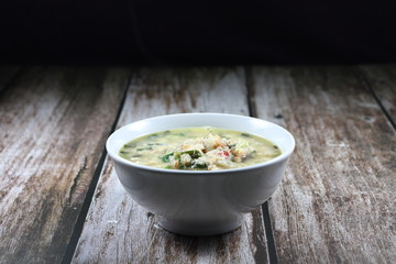 Soup of spicy fish meat with coriander, red chilly and herbal vegetable. Famous traditional fish paste side dish in Asia restaurant. 
