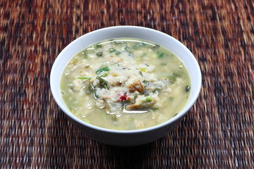 Soup of spicy fish meat with coriander, red chilly and herbal vegetable. Famous traditional fish paste side dish in Asia restaurant. 
