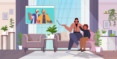 mother and son having virtual meeting with grandparents in web browser window during video call family chat communication concept living room interior horizontal full length vector illustration