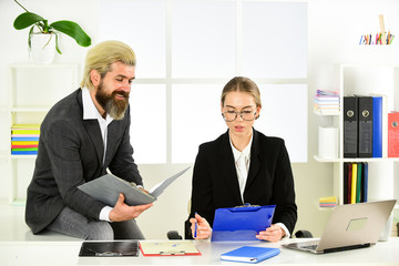 Man and woman boss manager director. Subordination and teamwork. Business report. Colleagues...