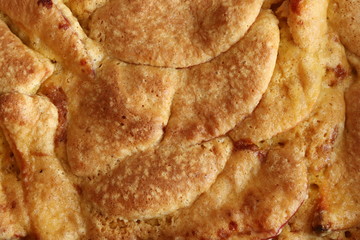 Homemade apple pie with a golden crust. Charlotte pie. Baking background. View from above