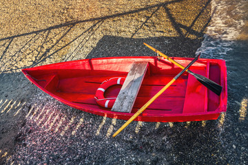 red rescue boat on the shore, top view