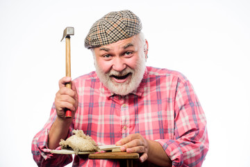 Custom made shoes. Man bearded handyman working with tools white background. Handmade concept. Designing shoe. Craftsman laborer worker. Shoe repair shop. Senior master with hammer repairing shoe
