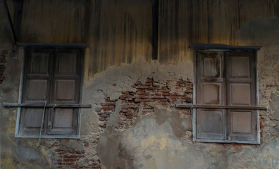 Old wooden windows on the old wall. Traditional Architecture style, Selective focus.