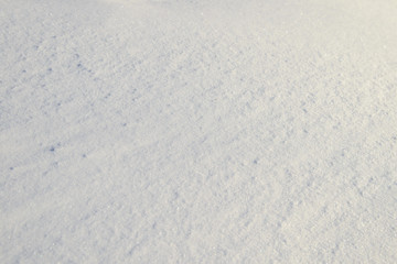 Smooth surface of a snowdrift on a Sunny winter day