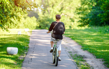 Cyclist ride on the bike path in the city Park
