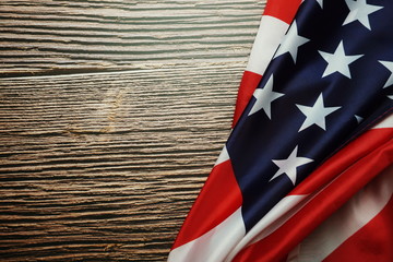 Fototapeta na wymiar American USA Flag on wooden background