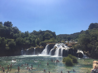 Obraz premium Groups of people swimming in Krka falls, Croatia