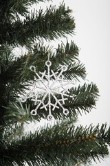 Decorative snowflake hanging on christmas tree