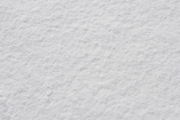 Obraz premium Texture of fresh snow covering the ground in winter .