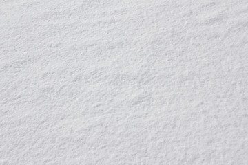 Obraz premium Texture of fresh snow covering the ground in winter .