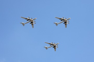 A group of Tu-95MS turboprop strategic bombers in the sky over Moscow during the dress rehearsal of the parade dedicated to the 75th anniversary of Victory
