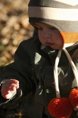 Preschooler observing something in his hand