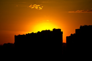 orange sunset over high-rise buildings close-up