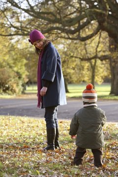 Mother watching her son walking towards her