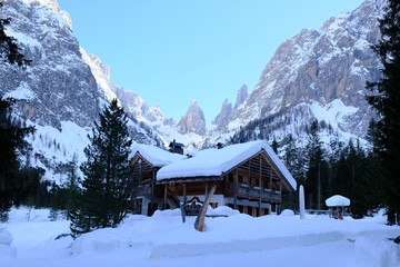 Fototapeta na wymiar Rifugio Fondovalle in beautiful mountain Val Fiscalina in Dolomites in snowy winter day. Sexten Dolomites, South Tyrol, Italy 