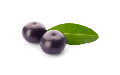 Fresh acai berries with leaf isolated on white