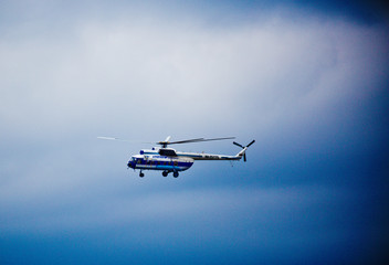 passenger helicopter in the sky close up