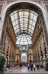 Obraz premium Panorama inside the Galleria Vittorio Emanuele II in Milan. This gallery is famous shopping mall and Milan landmark. Beautiful interior of the old Milan store in summer.