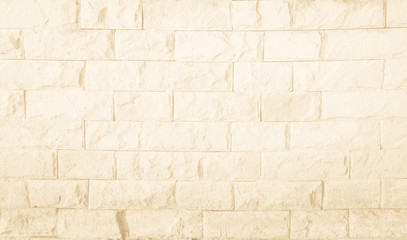 Empty Background of wide cream brick wall texture. Brown brick wall texture background in room at subway. Brickwork stonework interior, rock old concrete grid uneven horizontal architecture wallpaper.